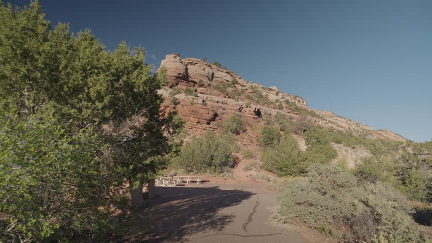 Colorado National Monument Park near the city of Grand Junction. Sheer-walled, Red rock canyons, Rim Rock Drive, Towering monoliths within a vast plateau and canyon panorama USA