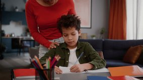 Little African American child boy kid studying at home pretend study mother controlling woman female mom girl walk away son take mobile phone playing online game play smartphone addiction gen z addict - Powered by Shutterstock - Get 15% off with code: PIKWIZARD15