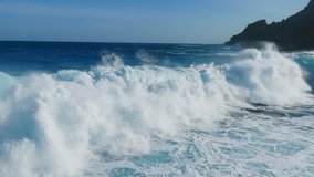 Powerful Ocean Waves Crashing Against the Rocky Coastline. Aerial view of Large Waves Crash Against the Rocky Shore. Ocean surf - Powered by Shutterstock - Get 15% off with code: PIKWIZARD15