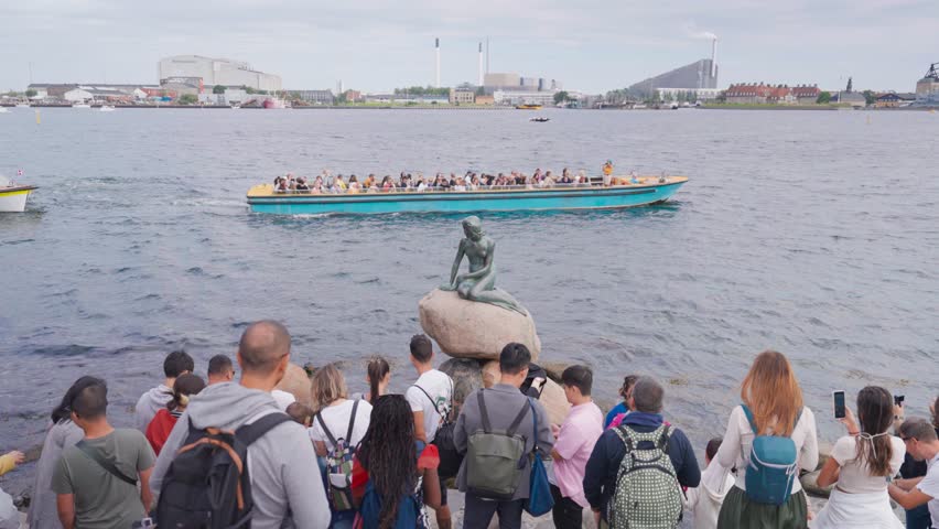Copenhagen , Denmark - 08 16 2024: Large crowd of people near little Mermaid statue