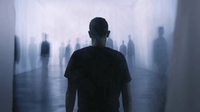 Man Walking Through Mysterious Dark Hallway Towards Shadowy Figures Surreal Abstract Horror Suspense Scene - Powered by Shutterstock - Get 15% off with code: PIKWIZARD15