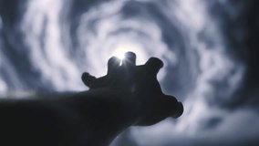 Dark Hand Silhouette Reaching For Moonlight Through Mystical Swirling Clouds Dramatic Sky - Powered by Shutterstock - Get 15% off with code: PIKWIZARD15