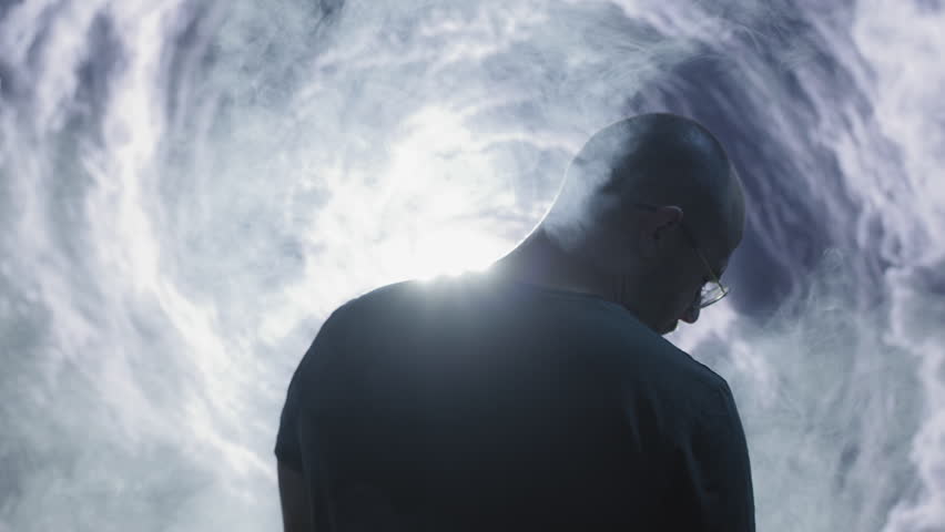 Silhouetted Man Reaching Toward Mystical Light Portal Spiritual Journey Transformation Enlightenment