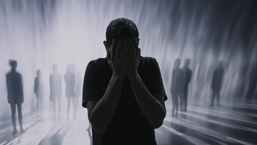 Anxious Person Covering Face Surrounded By Blurred Shadowy Figures Mental Health Fear Isolation