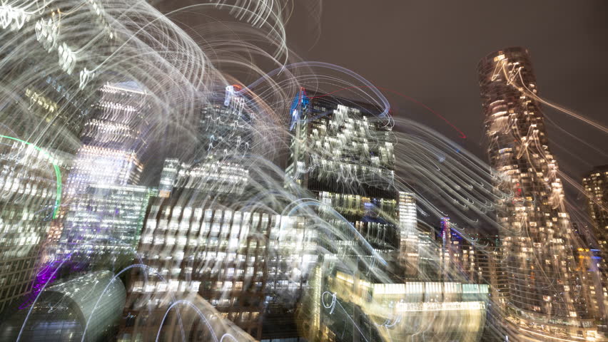 Timelapse of the skyline of canary wharf, london docklands, london england made into abstract light trails at night