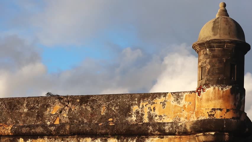 panning across a tower at Castillo San Felipe del Morro in Old San Juan  (bastion lighthouse Guerite bartizan) at sunset beautiful golden light spanish fort travel puerto rico caribbean island tourism
