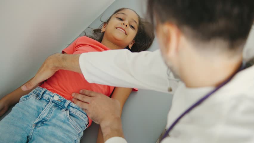 A comprehensive Medical Examination of a Child on the couch is performed by a skilled Pediatric Doctor to guarantee optimal health and proper development - Powered by Shutterstock - Get 15% off with code: PIKWIZARD15