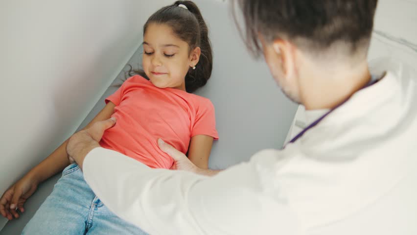 A comprehensive Medical Examination of a Child on the couch is performed by a skilled Pediatric Doctor to guarantee optimal health and proper development - Powered by Shutterstock - Get 15% off with code: PIKWIZARD15