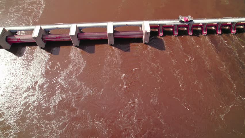 Overview aerial bridge construction equipment on top of US Lock and Dam No. 7 on the Mississippi River, Minnesota, aerial view