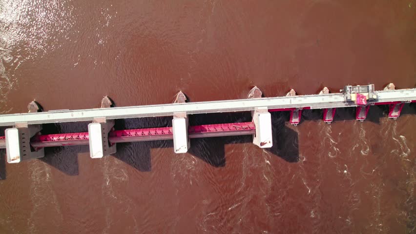 Top down maintenance vehicle on top of US Lock and Dam No. 7 on the Mississippi River, Minnesota, aerial view