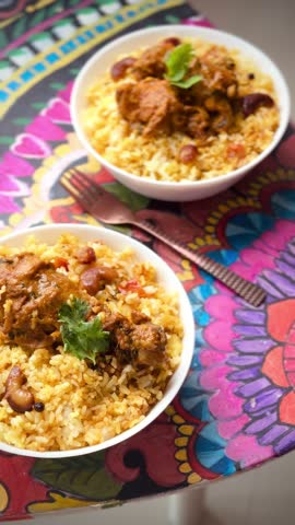 Chicken biryani Spicy Indian Malabar biryani Hyderabadi biryani Dum Biriyani pulao golden bowl Kerala India Sri Lanka Pakistan basmati rice mixed rice dish with meat curry Ramadan Kareem Eid