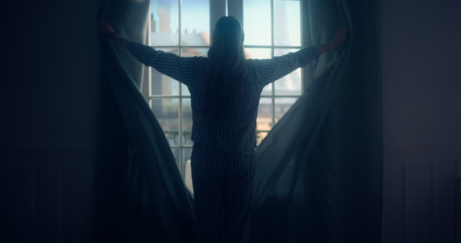Wearing Cozy Pajamas, Female Draws Back the Curtains and Pushes Open the Balcony Doors, Inviting the Cool Morning Breeze Inside. She Steps Out, Admiring the Beautiful Eiffel Tower in the Distance
