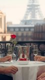 Vertical Screen: Champagne Glasses Clink in Celebration as a Couple Enjoys a Romantic Evening on a Paris Balcony. They Hold Hands Together. Eiffel Tower Stands in the Distance - Powered by Shutterstock - Get 15% off with code: PIKWIZARD15