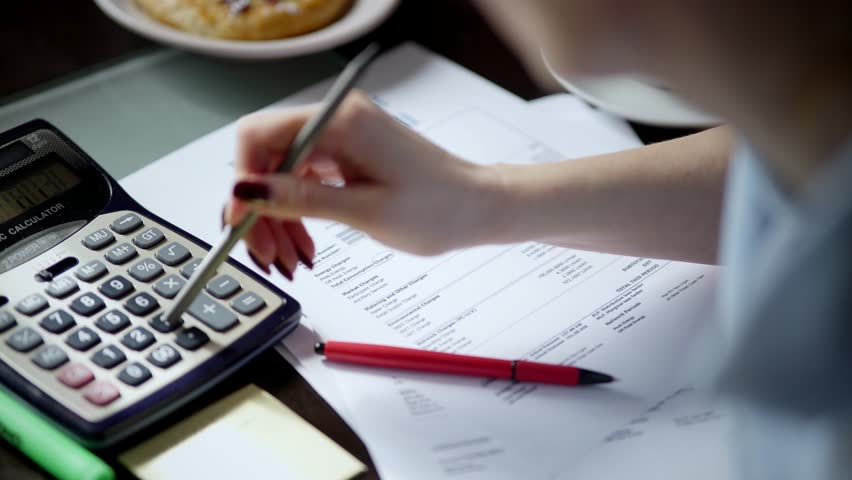 Family Tax Bill Debt Overspend. High Tax. Paying bills through on-line application using laptop,sorting out domestic, household papers. Planning family expenses manage budget, doing paperwork at home