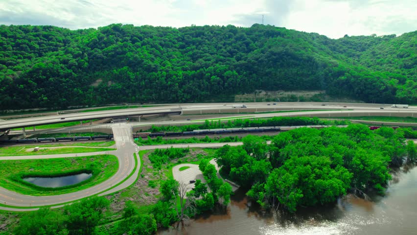 Drone shot of a dry van truck crossing the Dresbach Bridge over the Mississippi River between Wisconsin and Minnesota. La Crosse WI and La Crescent MN. USA