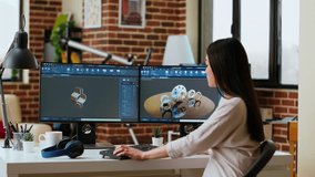 Professional industrial designer working with CAD software on dual monitors, creating 3D prototypes for a tech driven environment. 3D modeling software for innovative design. Camera B. - Powered by Shutterstock - Get 15% off with code: PIKWIZARD15