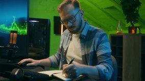 Focused serious Caucasian man freelancer male modern guy working writing results programmer crypto analyst typing keyboard computer pc concentration e-commerce home neon night trading stock deadline - Powered by Shutterstock - Get 15% off with code: PIKWIZARD15