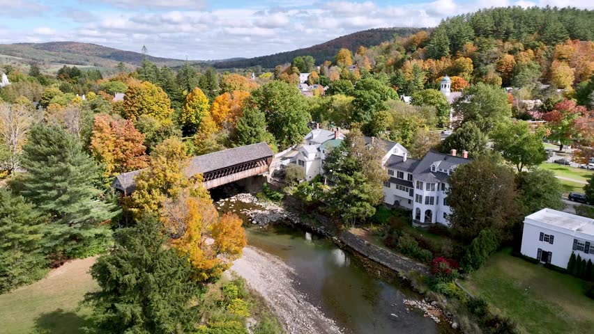 covered bridge on outskirts of woodstock vermont in new england in fall with autumn leaf color