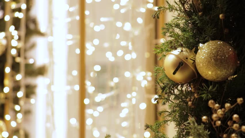 Sparkling fairy lights and gold jingle bells on a garland, Christmas holiday background - Powered by Shutterstock - Get 15% off with code: PIKWIZARD15