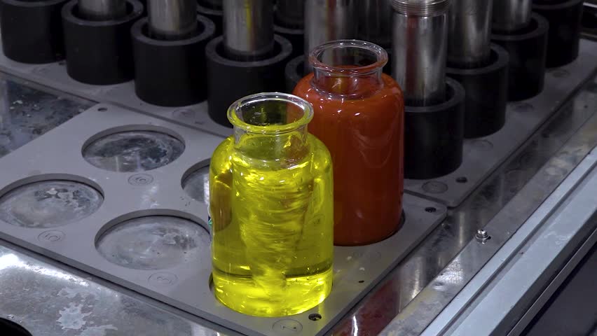Close-up view of beakers containing liquid in chemistry laboratory.