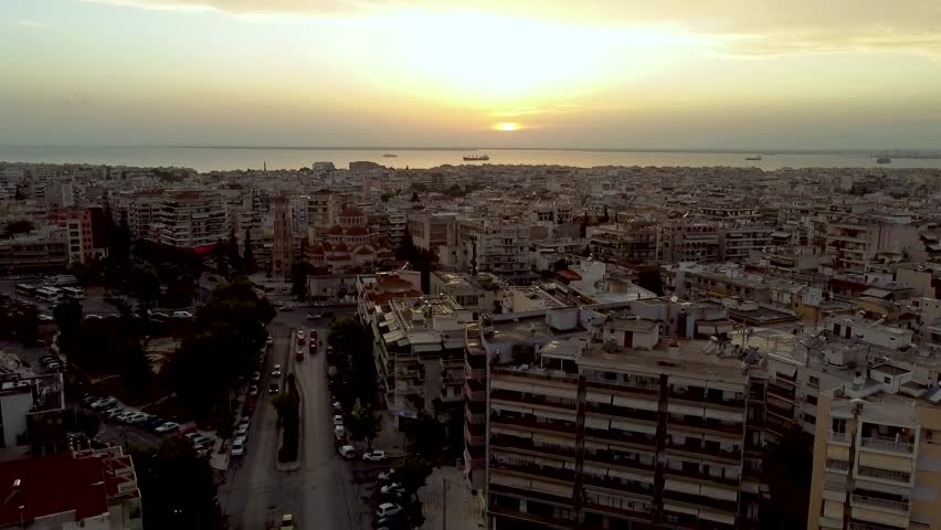 Thessaloniki Greece City Center Aerial Crane Shot, Charilaou Region, Golden Hour Backlit View at Dawn