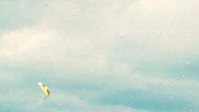 Autumn leaves floating through fall sky with clouds in beautiful sunny weather - Powered by Shutterstock - Get 15% off with code: PIKWIZARD15