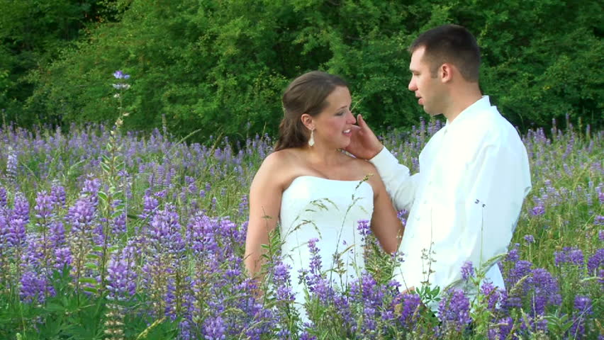 Model released bride and groom portraits in Oregon flower field on their wedding