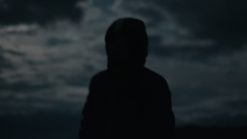 Silhouette of the person watching in the night sky