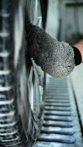 Washing Car Wheel with Foam Mitt