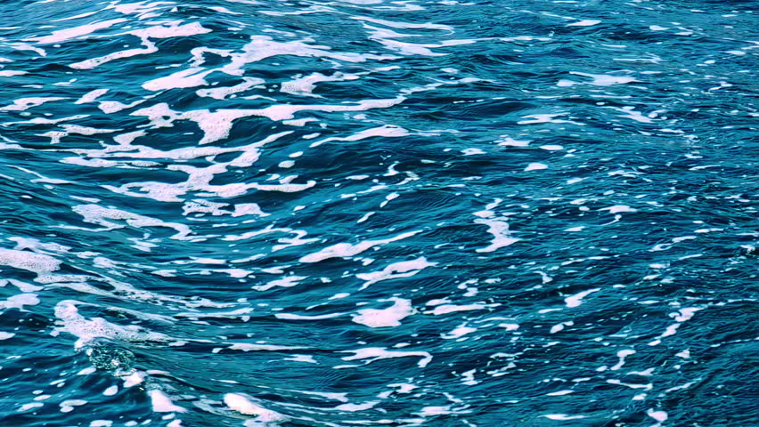 Closeup shot of the ripple of a sea wave moving in golden ratio, blue nature