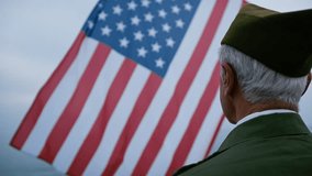 Old Veteran Soldier Looking Up At The USA Flag  - Powered by Shutterstock - Get 15% off with code: PIKWIZARD15