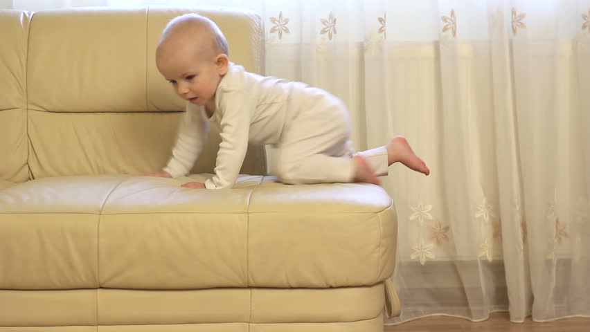 Father spending time with baby, learning to get down from couch | Shutterstock HD Video #3629276