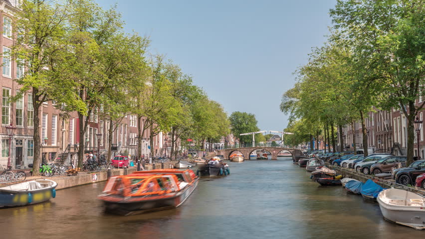 Timelapse panorama of a busy canal boat trip in Amsterdam