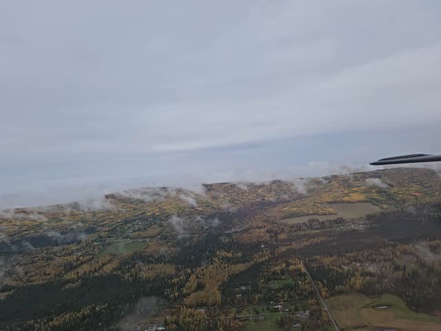 A view of the town from above Fairbanks, Alaska, in a cloudy autumn day.
