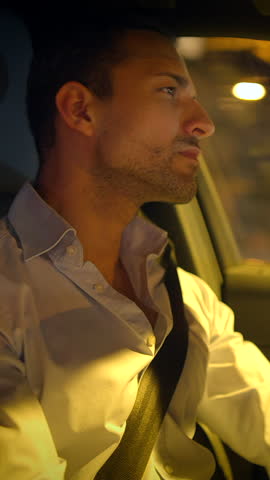 Driving at night A focused man skillfully navigating the road while reflecting on life