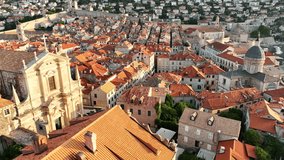 Stunning Rooftops and Historic Architecture of Dubrovnik, Croatia at Sunset Overlooking the Picturesque Adriatic Coast. Church of St. Ignatius in Dubrovnik old city  - Powered by Shutterstock - Get 15% off with code: PIKWIZARD15