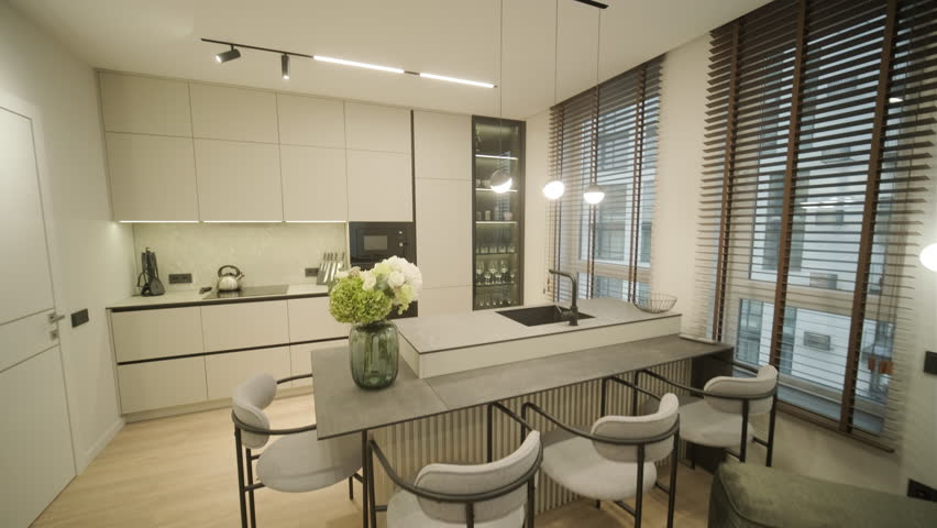 Modern Minimalist Kitchen Interior with Large Windows and Neutral Tones