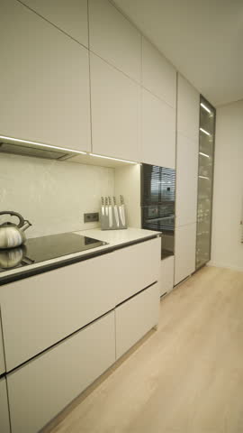 Modern minimalist apartment interior featuring simple decor, neutral tones, and clean lines. The design emphasizes functionality, creating a serene and organized living space.
