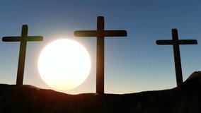 Three wooden crosses stand on a hilltop, with the sun rising on the horizon behind them, creating a radiant halo around the central cross as it rises. - Powered by Shutterstock - Get 15% off with code: PIKWIZARD15