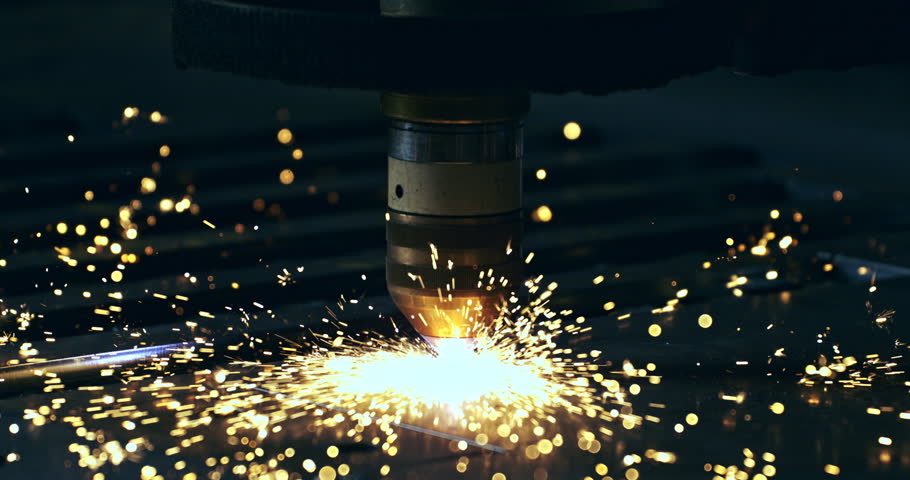 Super slow motion macro of maintenance worker or welder using high-tech industrial welding machine to weld metal steel with flying sparks in workshop or factory setting at 1000 fps.