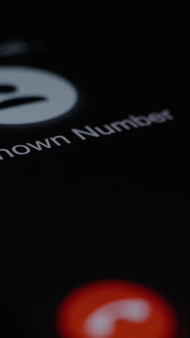 Vertical video. Vertical video. Blurred screen showing "Unknown Number," with a red glow highlighting a potential decline action.