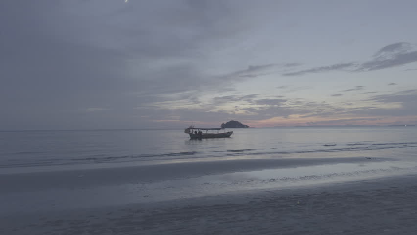 Majestic Sunset and the Stillness of a DockeImmerse yourself in the captivating beauty of a sunset illuminating a peaceful harbor. High quality 4k footage