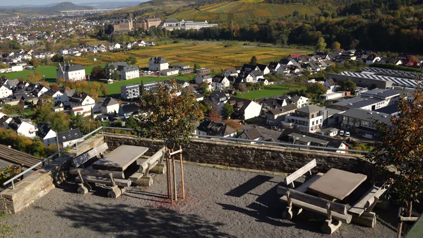View of the city of Bad Neuenahr-Ahrweiler, Germany, warm autumn evening, vineyards in the rays of the sun, and the city is visible in the distance.