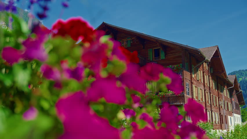 Wooden house in Switzerland in traditional style standing in a picturesque place. Switzerland