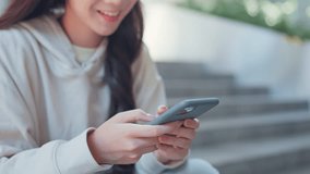 Closeup- Hands of young woman typing text message using social media on mobile smartphone in the city - Powered by Shutterstock - Get 15% off with code: PIKWIZARD15