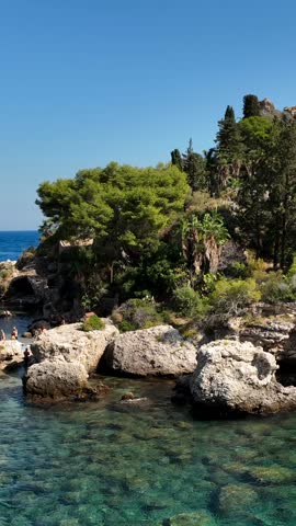 The sea and the beach of Isola Bella in Taormina, Sicily, Southern Italy.
Aerial shot of the bay of Taormina with Isola Bella connected to the mainland by an isthmus of land.