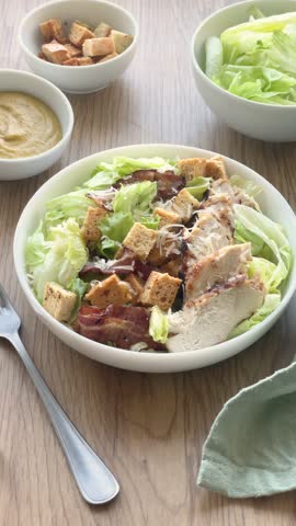 A bowl  of  Fresh Caesar salad on the table