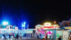 Dreamy nighttime at an amusement park, blurred neon lights creating magical vibe. Silhouetted visitors explore the vibrant midway, rides and attractions paint the darkness in color. Panning shot.
 - Powered by Shutterstock - Get 15% off with code: PIKWIZARD15