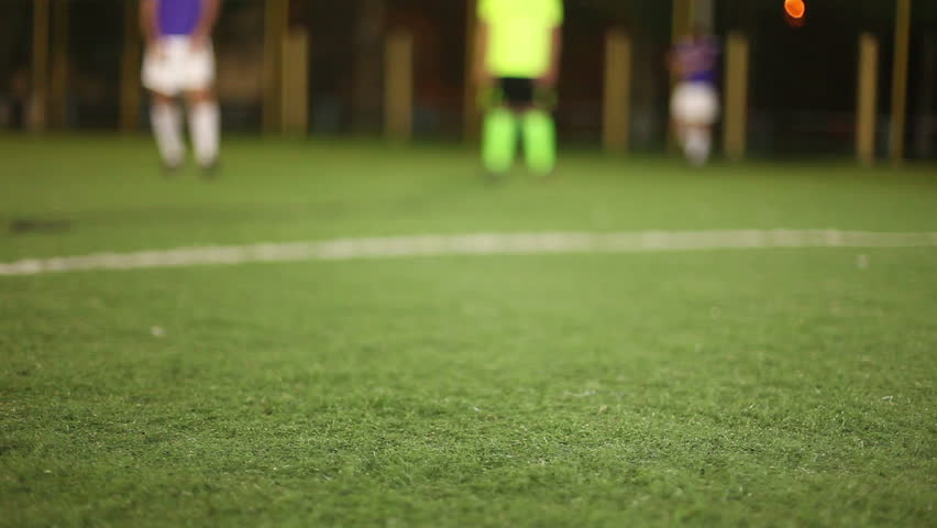 Shot on goal (ball kick) by a football (soccer) player (forward)