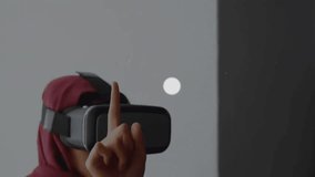 Animation of network of connections with icons over biracial woman in hijab. Global business, computing, data processing and connections concept digitally generated video. - Powered by Shutterstock - Get 15% off with code: PIKWIZARD15